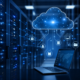 Laptop connected to cloud servers and digital network lines representing an integrated management system.