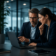 Business professionals collaborating on a laptop in a modern office
