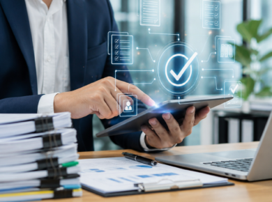 Business professional using a tablet with a digital checkmark interface in a modern office